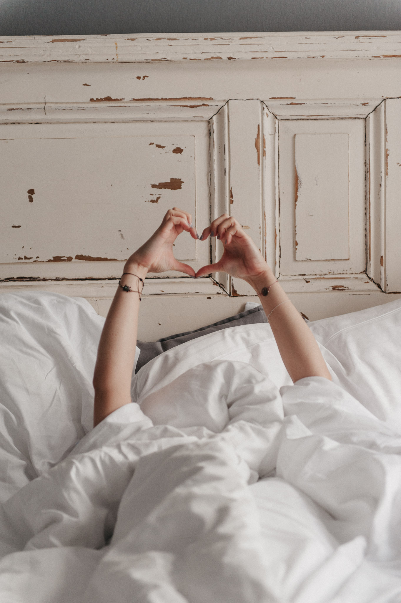 woman making a heart with her hands